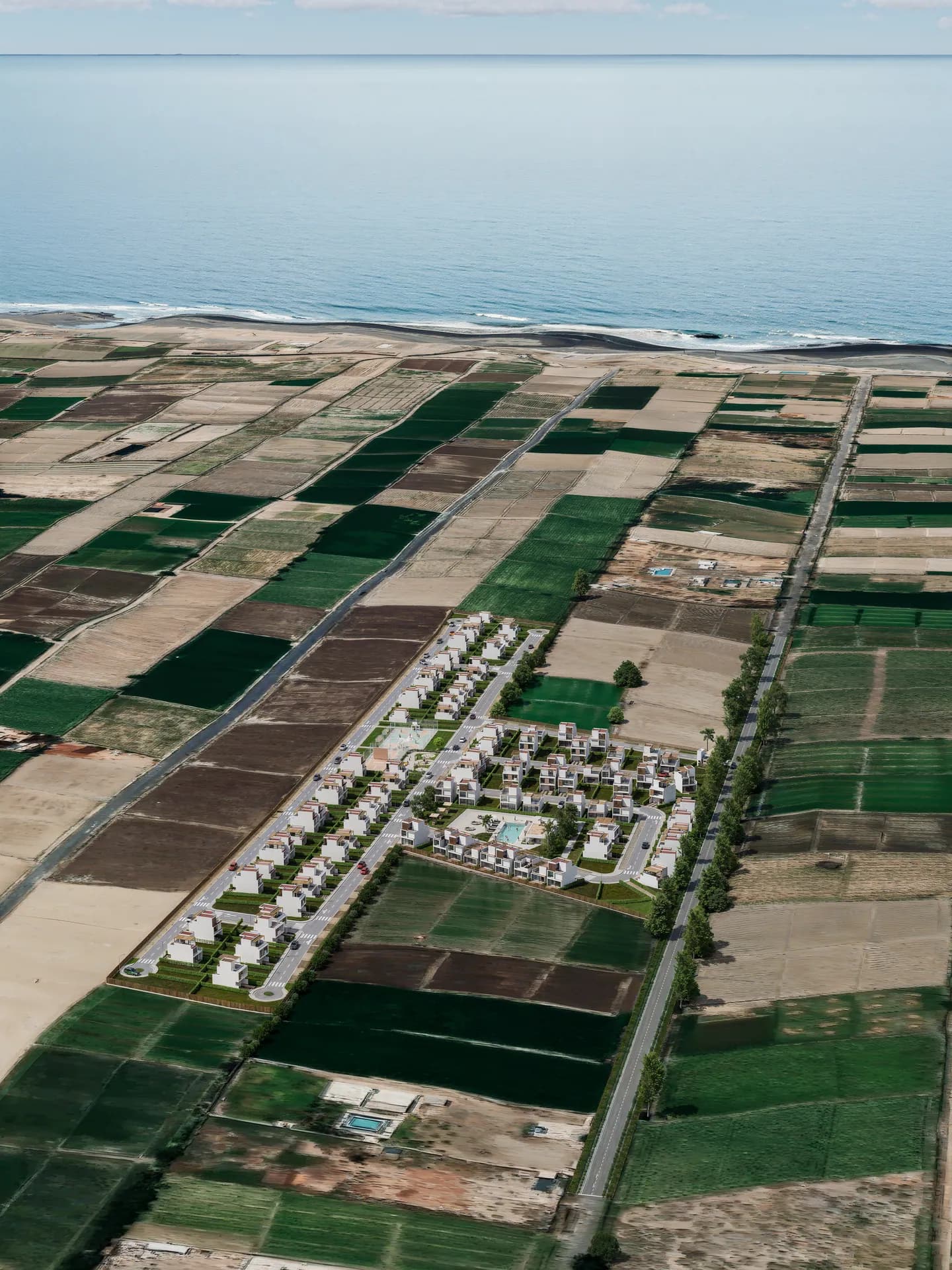 Vista aérea vertical del conjunto de Residencial Aonami con el mar al fondo