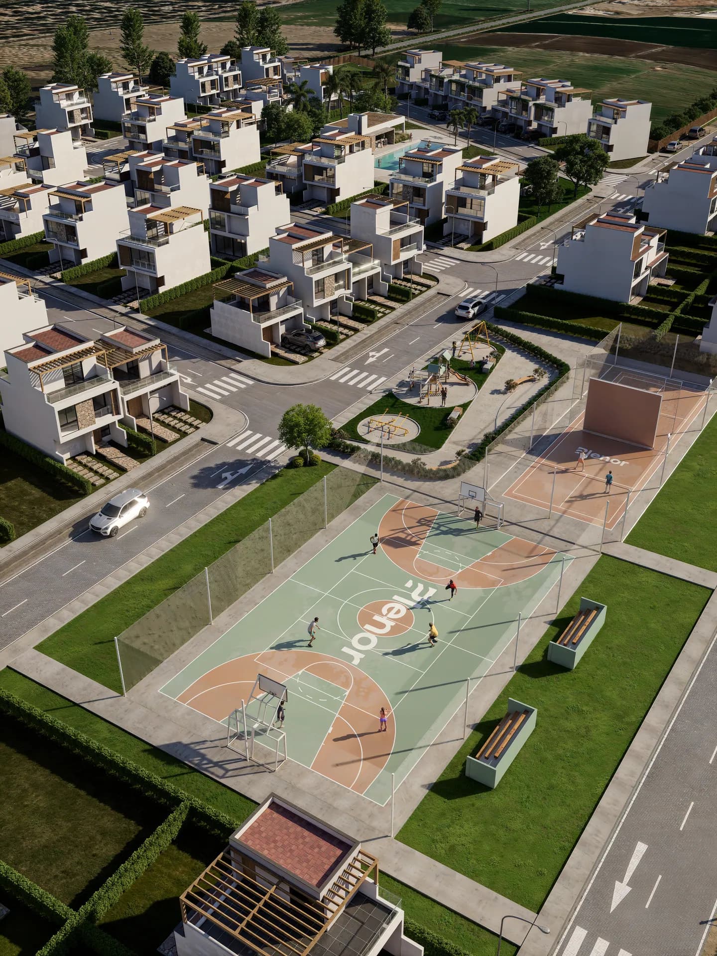 Vista aérea del parque deportivo con cancha multiusos, frontón y juegos