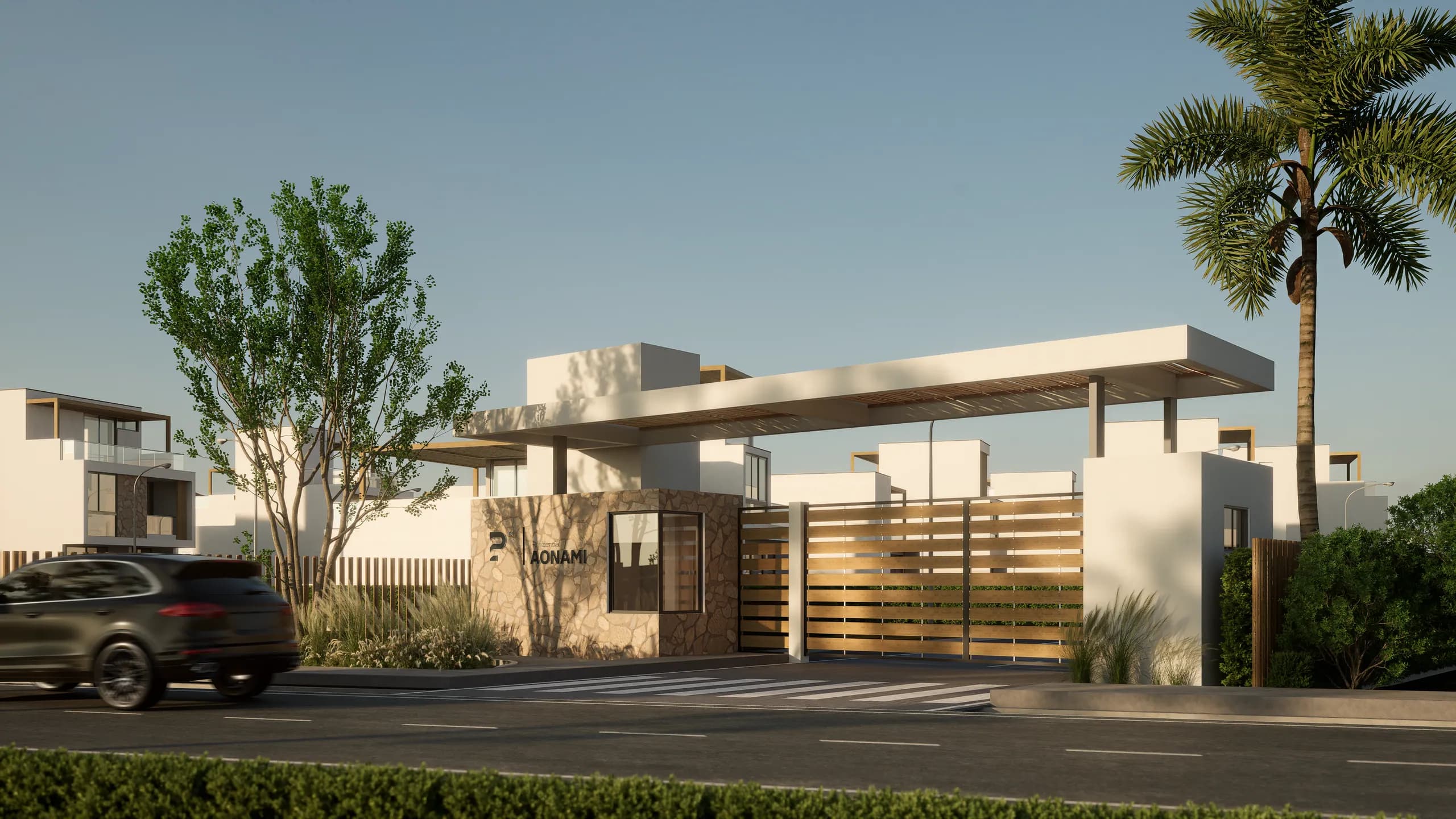 Pórtico de ingreso a Residencial Aonami al atardecer, con marquesina blanca y portón de listones de madera